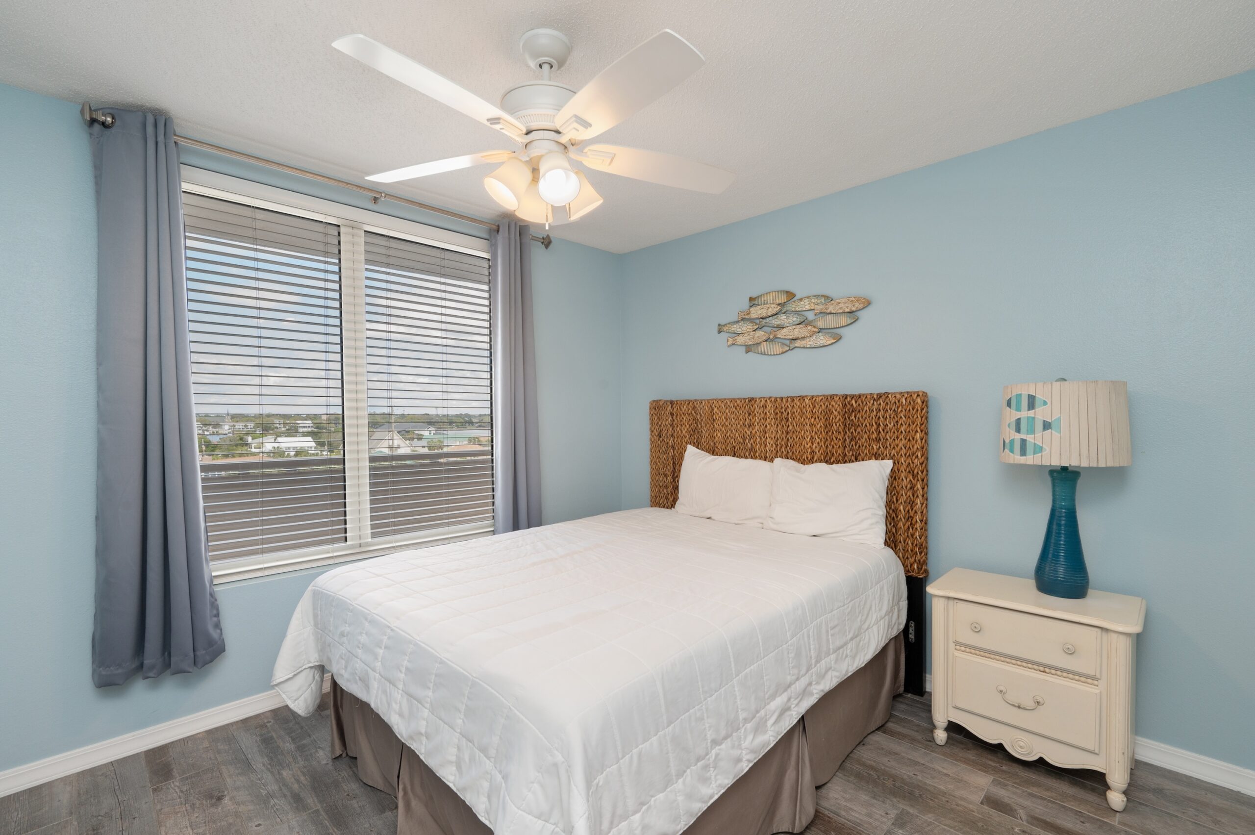 A queen bed in the second bedroom of our Okaloosa Island beach rental