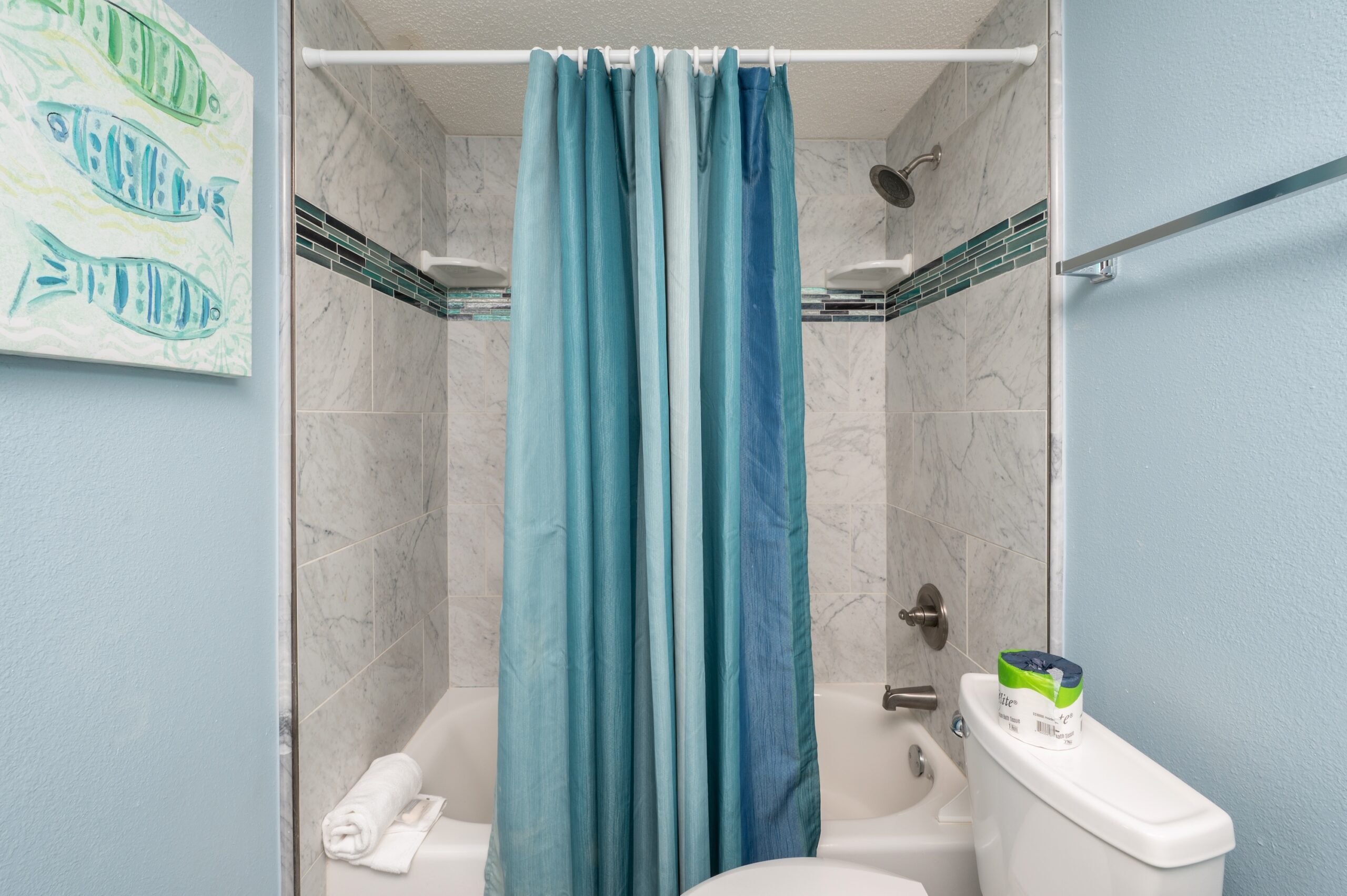 Striking tile accents in main bathroom in our beach vacation rental